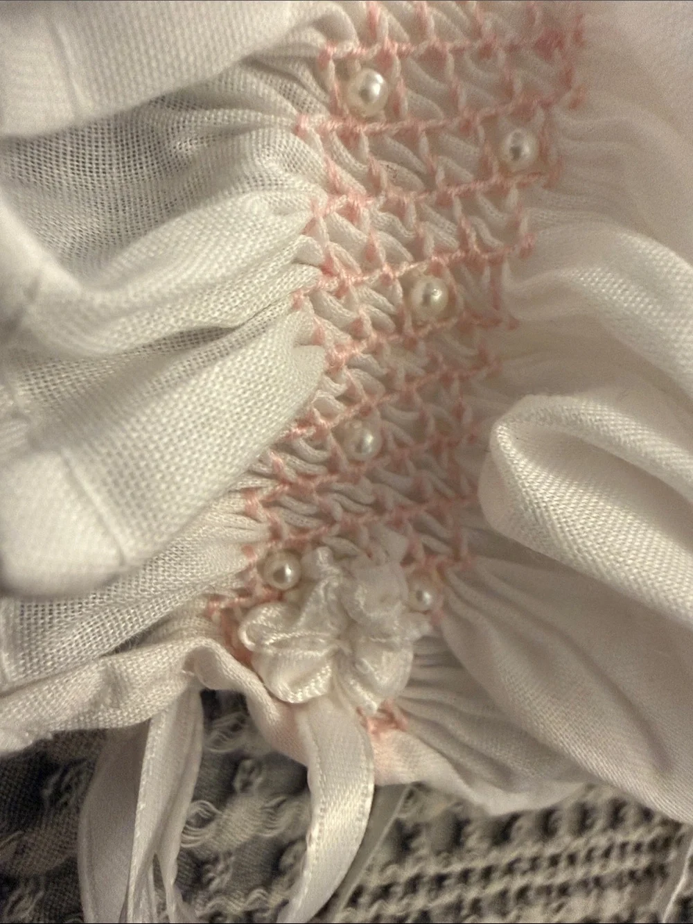 White Smocked Baby Bonnet with Pink Detail